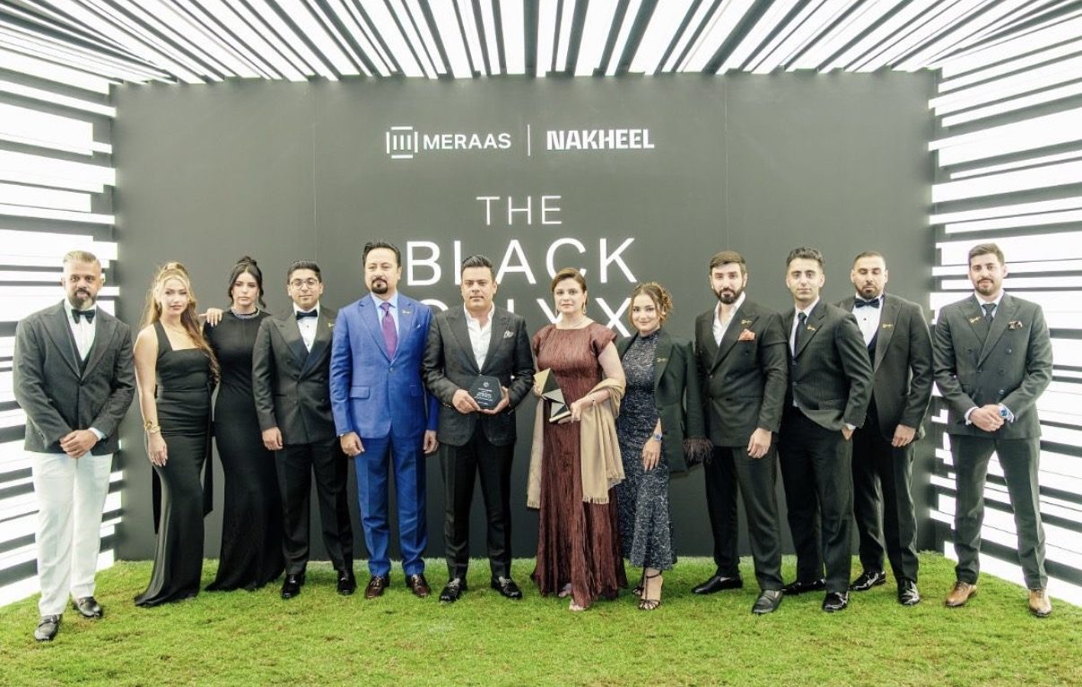 Saad Waqas and the Amber Homes Real Estate team receiving the Platinum Agency award — Meraas, Nakheel & Dubai Holding, 2025 on stage at the Black Onyx Awards, hosted by Meraas and Nakheel