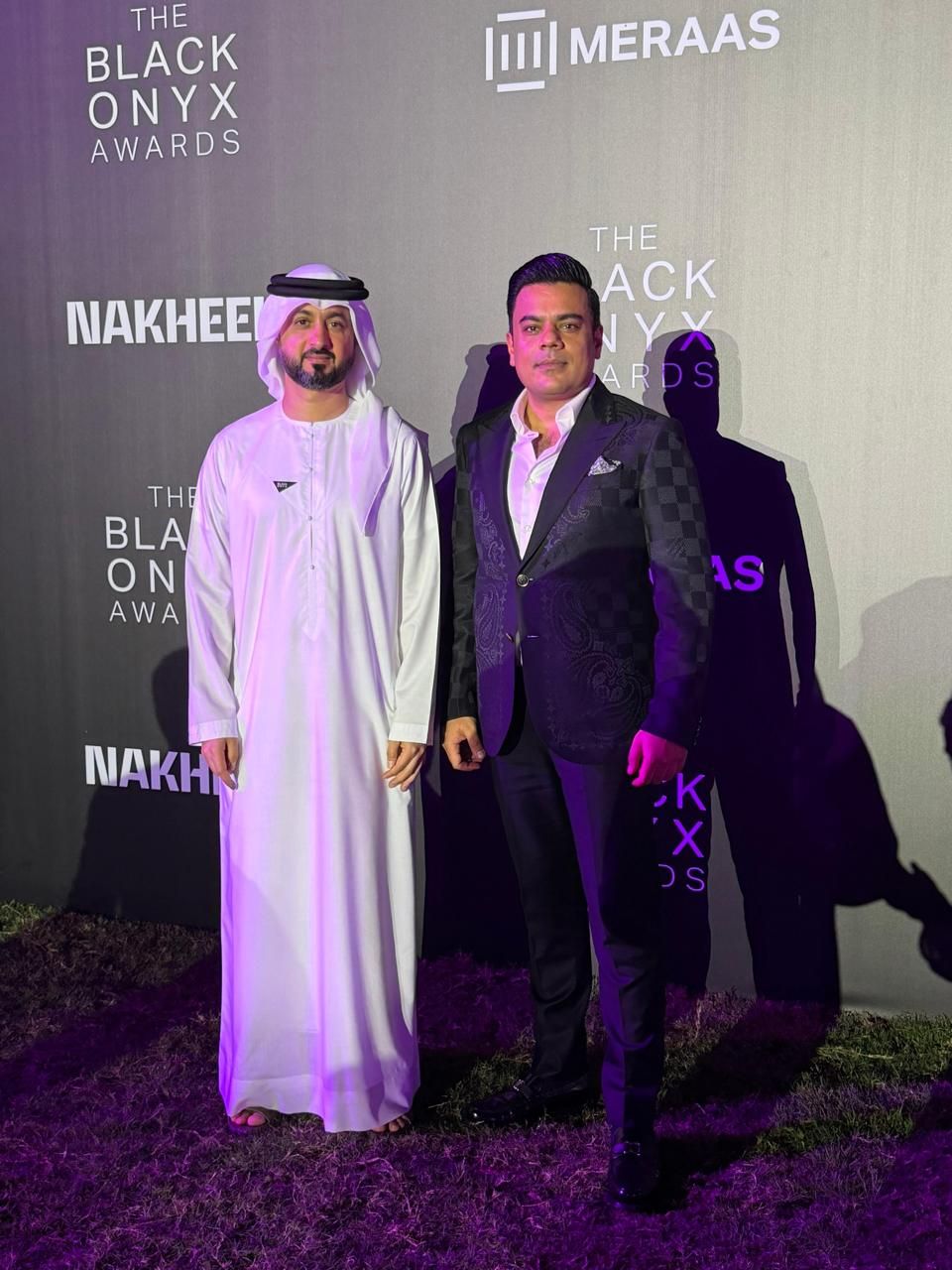 Saad Waqas with Dubai Holding management on the Black Onyx Awards red carpet with Meraas and Nakheel branding, Dubai